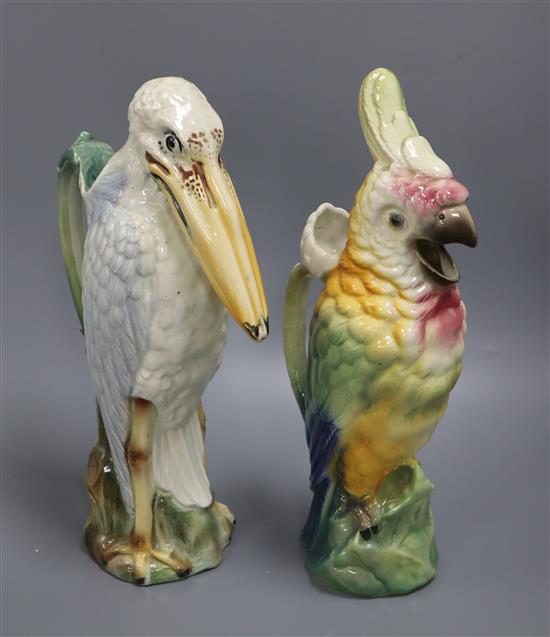 A pottery cockatoo water jug and a similar stork water jug tallest 33cm